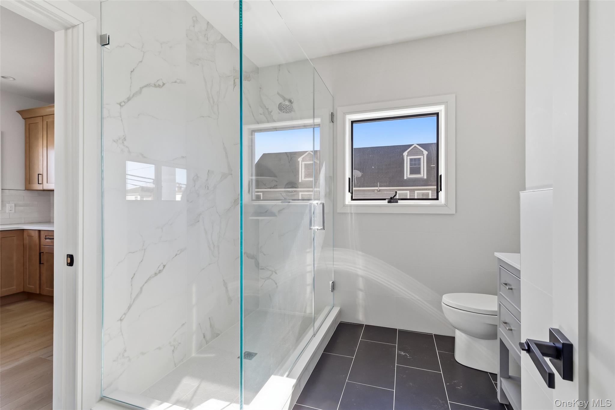 56 Suffolk Road Island Park, NY 11558 - Photo 14 of 14 a bathroom with a toilet and a shower