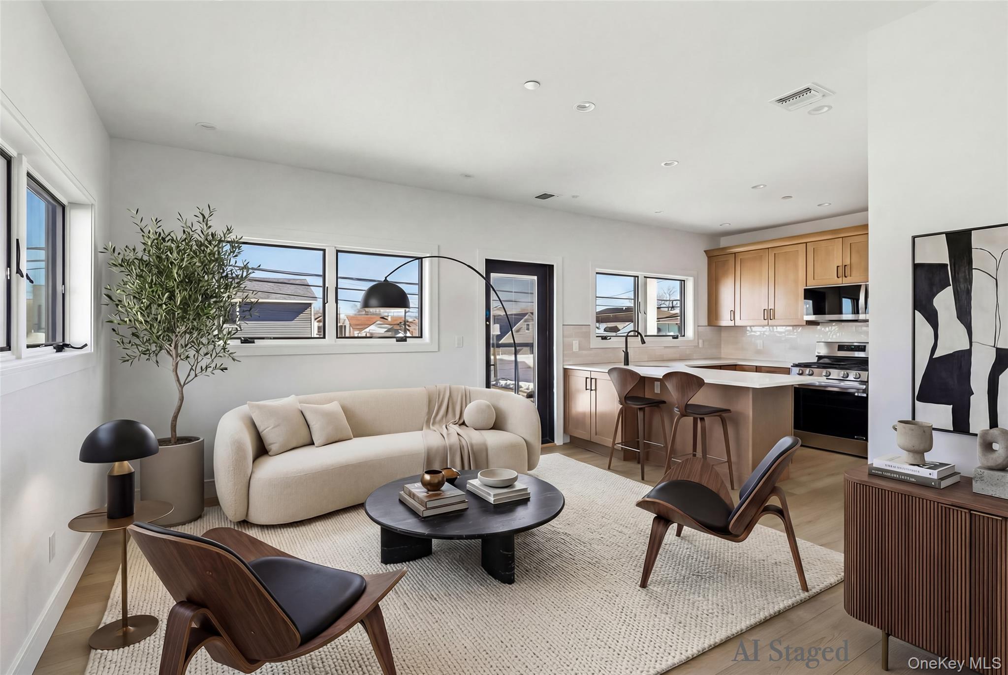 56 Suffolk Road Island Park, NY 11558 - Photo 3 of 14 a living room with furniture and a large window