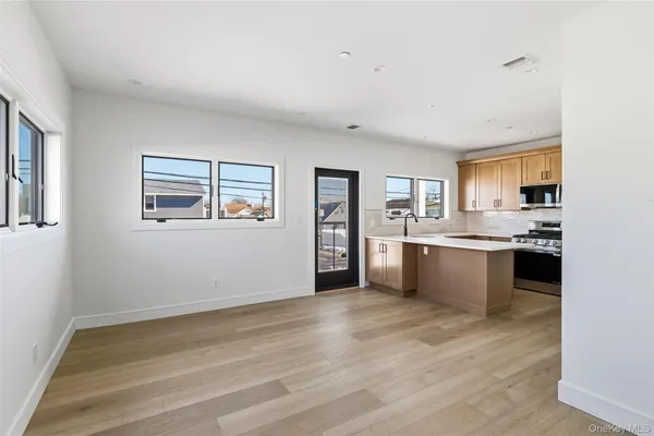 a view of kitchen with wooden floor