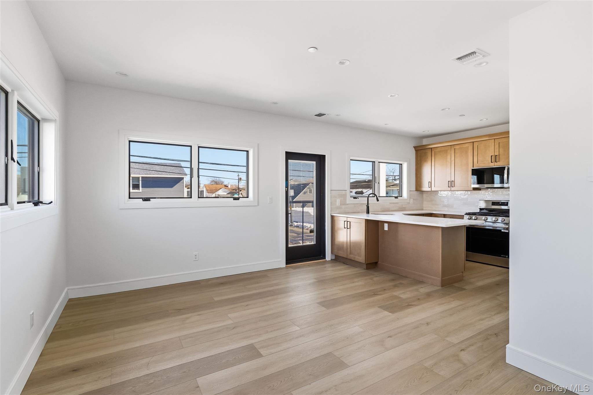 56 Suffolk Road Island Park, NY 11558 - Photo 4 of 14 a view of kitchen with wooden floor