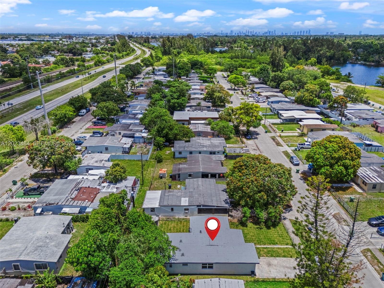 1961 Rutland Street Opa-Locka, FL 33054 - Photo 32 of 33 an aerial view of residential houses with outdoor space and parking