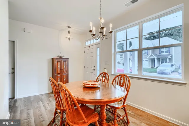 a spacious bathroom with a granite countertop sink and a mirror
