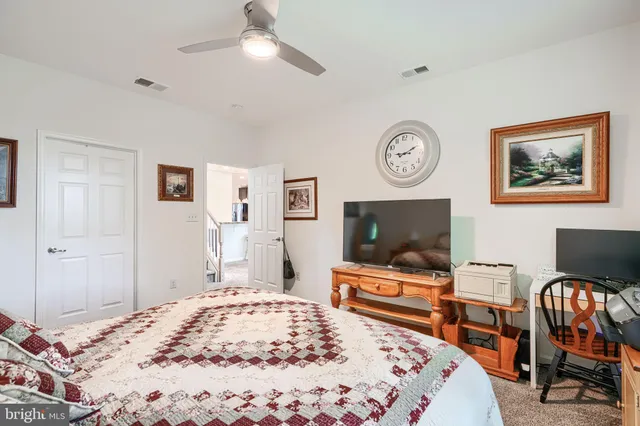 a bathroom with a double vanity sink a and a mirror