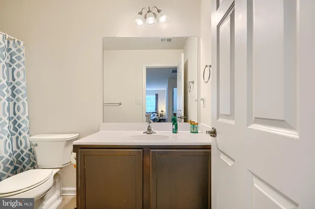 a front view of a house with a yard table and chairs