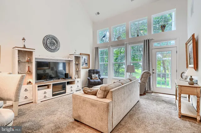 a living room with furniture and a table