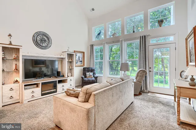 a dining room with furniture and chandelier