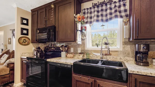 a kitchen with a sink and cabinets