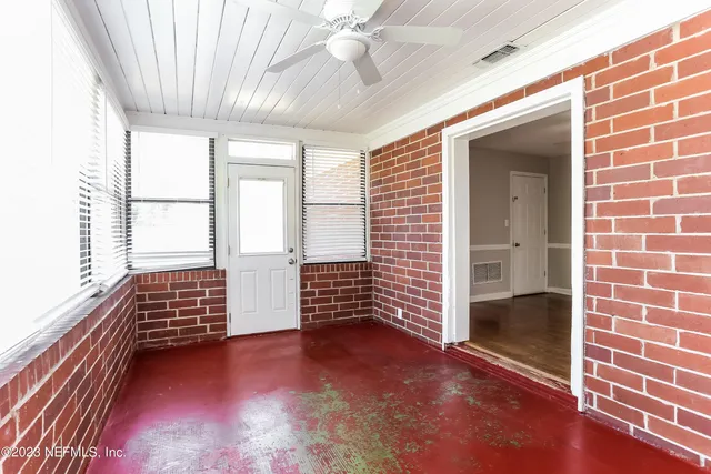 an empty room with windows