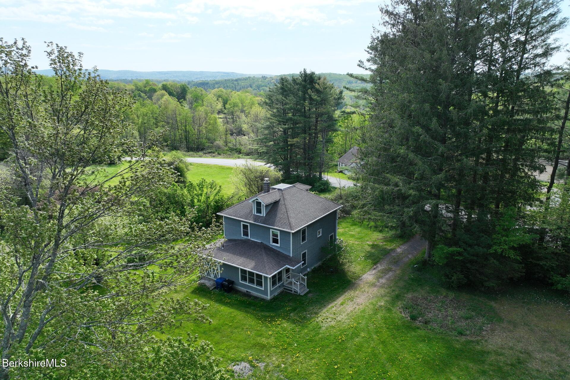86 Miner Road Lanesborough, MA 01237 - Photo 7 of 44 an aerial view of a house with a garden