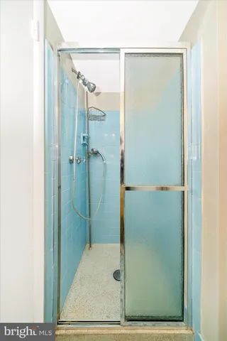a view of a room with wooden floor and closet in a room