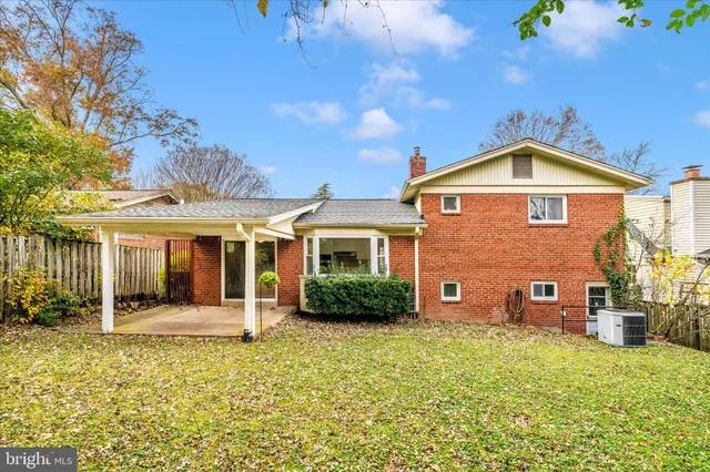 a view of potted plants with wooden fence