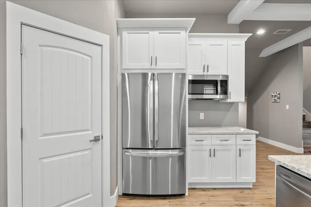 a kitchen with a sink stove and refrigerator