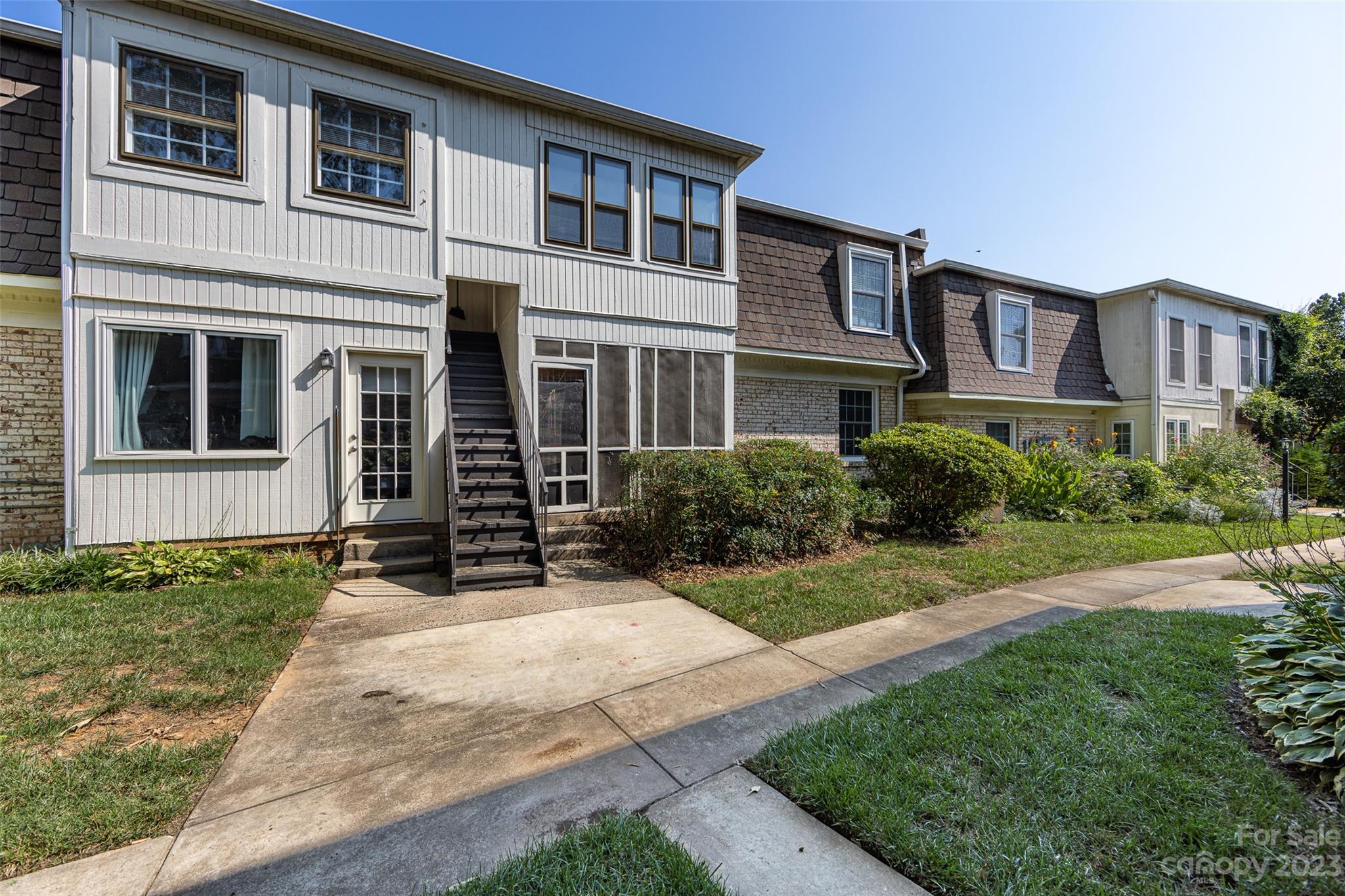 3520 Colony Road, Unit C Charlotte, NC 28211 - Photo 23 of 25 a front view of a house with garden