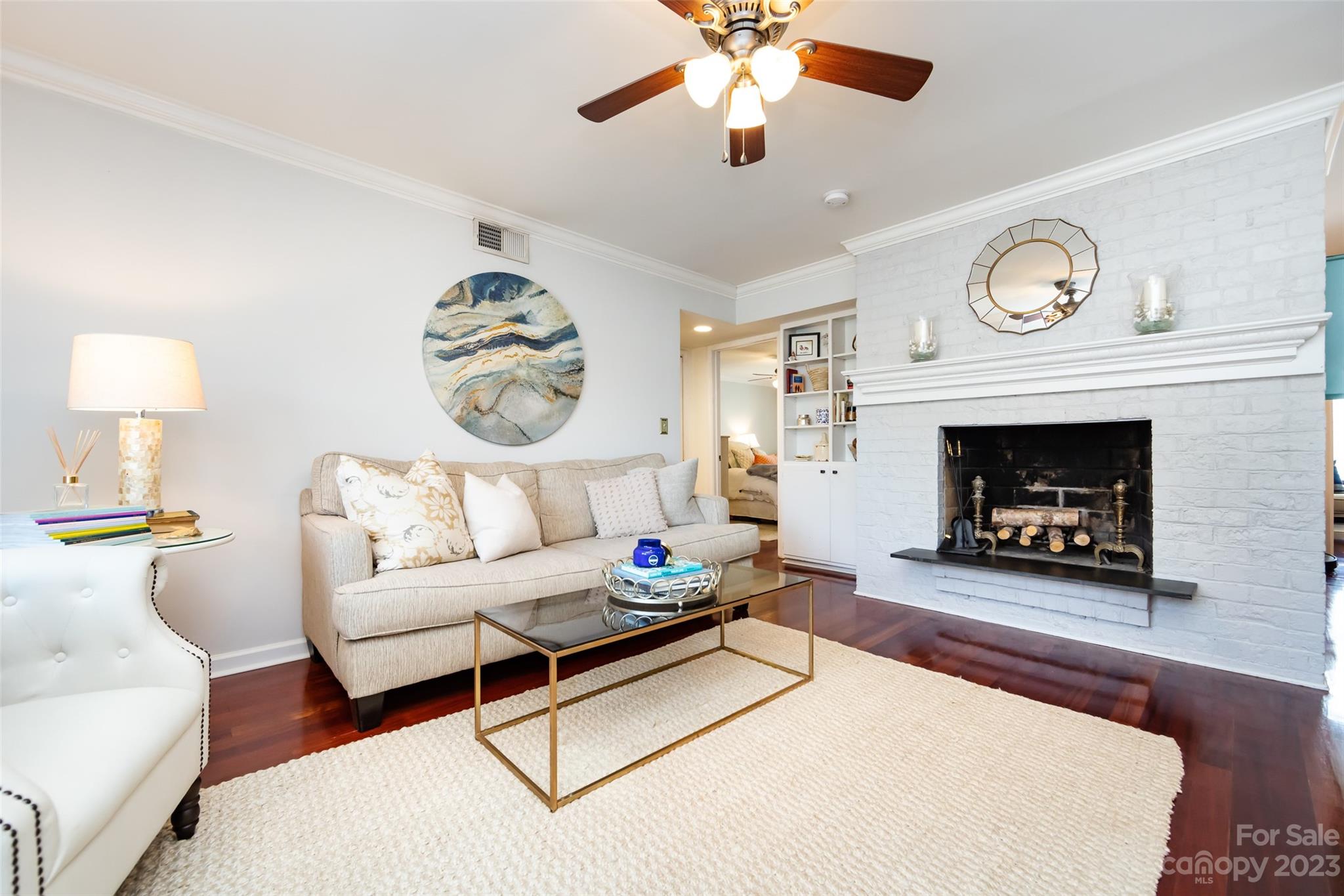 3520 Colony Road, Unit C Charlotte, NC 28211 - Photo 6 of 25 a living room with furniture a fireplace and a ceiling fan