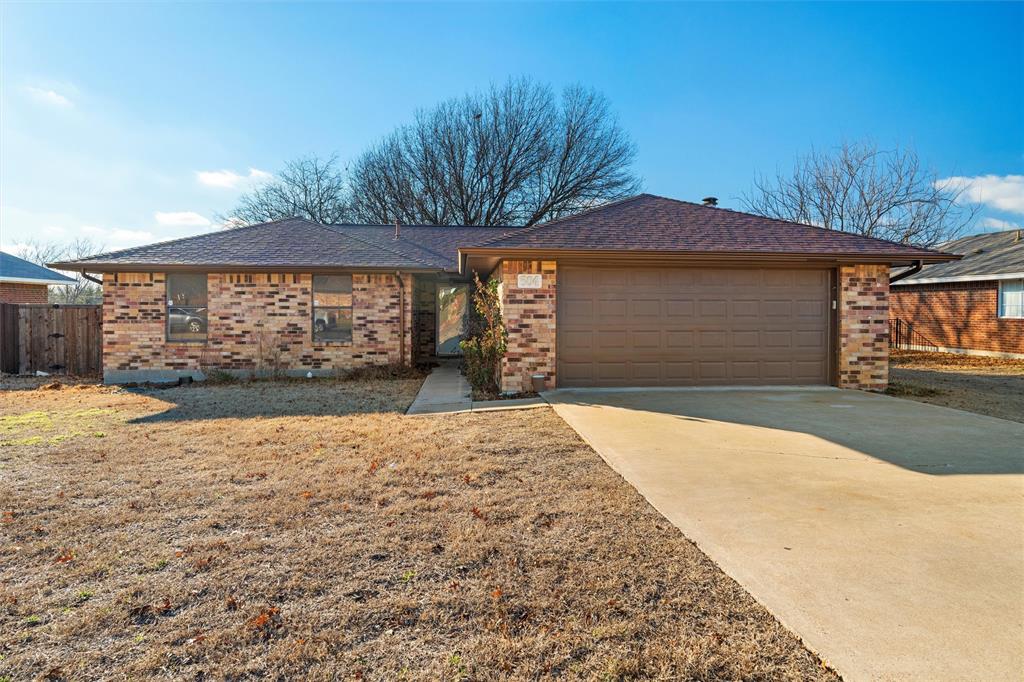 504 Bluebird Lane Red Oak, TX 75154 - Photo 1 of 1 a front view of a house with a yard and garage