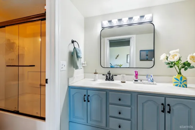 a living room with furniture pool and a floor to ceiling window