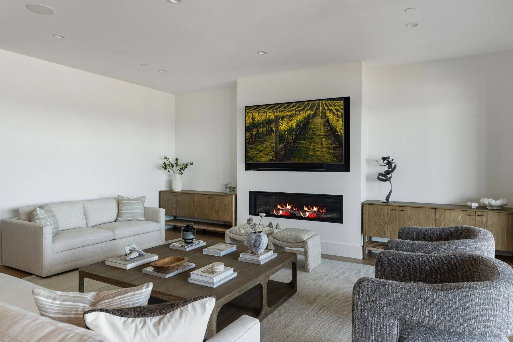 686 Dune Road Westhampton Beach, NY 11978 - Photo 12 of 37 a living room with furniture a fireplace and a flat screen tv