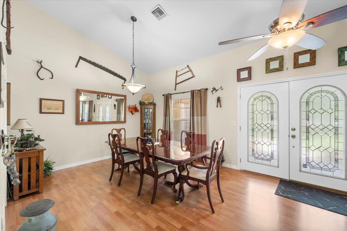 3455 Carter Road Mims, FL 32754 - Photo 7 of 38 a view of a dining room with furniture window and wooden floor