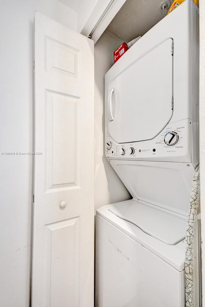 17100 North Bay Road, Unit 1511 Sunny Isles Beach, FL 33160 - Photo 16 of 71 a utility room with dryer and washer