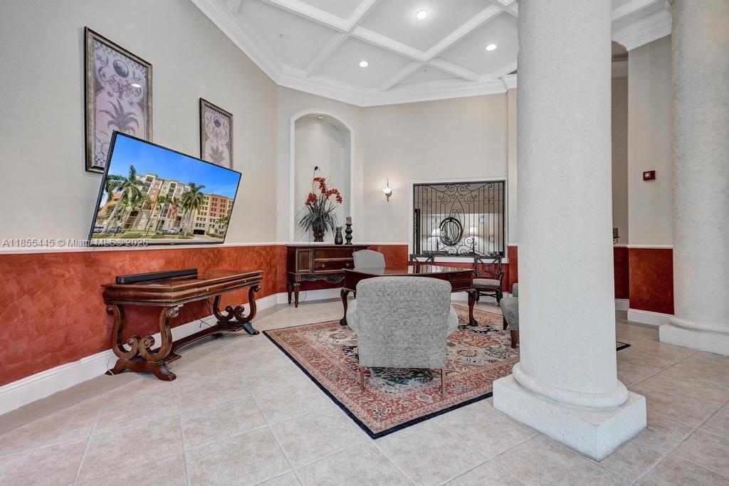17100 North Bay Road, Unit 1511 Sunny Isles Beach, FL 33160 - Photo 25 of 71 a living room with furniture and a potted plant