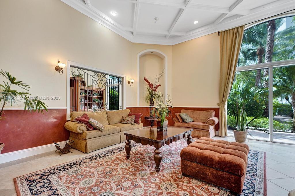 17100 North Bay Road, Unit 1511 Sunny Isles Beach, FL 33160 - Photo 26 of 71 a living room with furniture and a large window