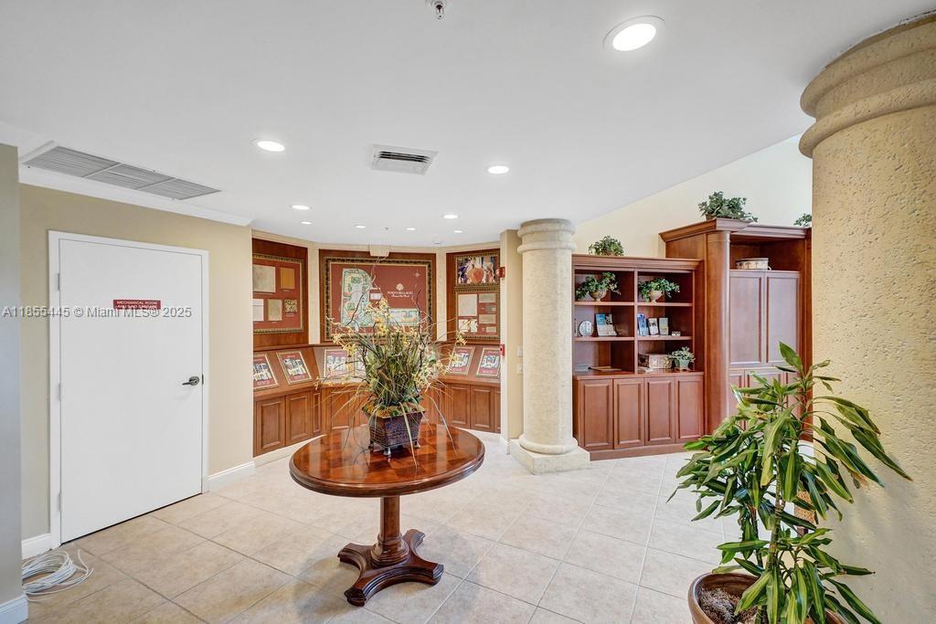 17100 North Bay Road, Unit 1511 Sunny Isles Beach, FL 33160 - Photo 28 of 71 a room with furniture and a potted plant
