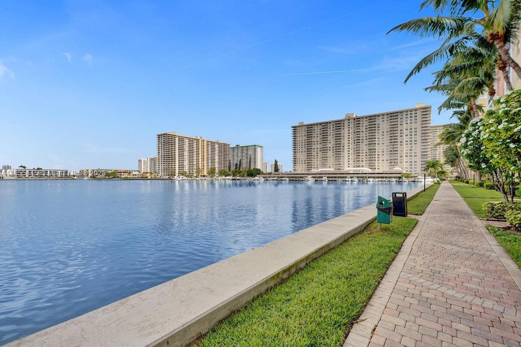 17100 North Bay Road, Unit 1511 Sunny Isles Beach, FL 33160 - Photo 40 of 71 a view of a swimming pool with a yard