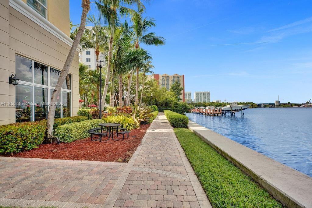 17100 North Bay Road, Unit 1511 Sunny Isles Beach, FL 33160 - Photo 42 of 71 a view of a lake with a garden