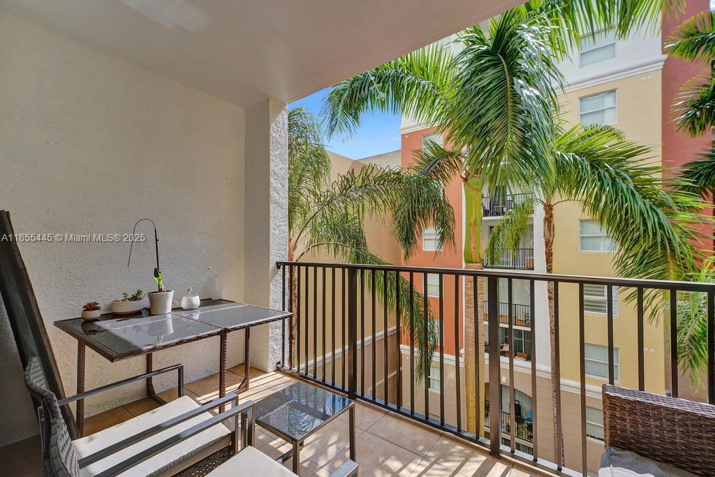 17100 North Bay Road, Unit 1511 Sunny Isles Beach, FL 33160 - Photo 50 of 71 a view of a balcony with a table and chairs