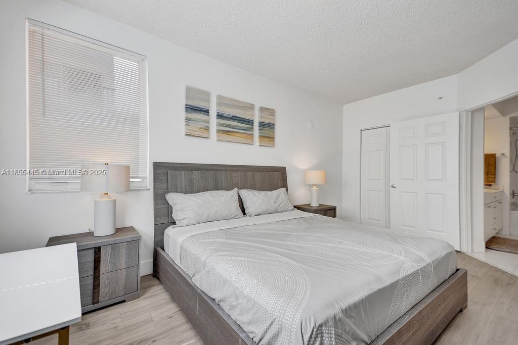 17100 North Bay Road, Unit 1511 Sunny Isles Beach, FL 33160 - Photo 54 of 71 a bedroom with a bed and a window
