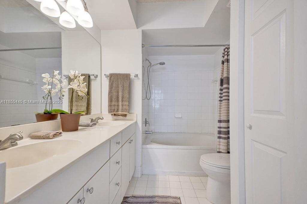 17100 North Bay Road, Unit 1511 Sunny Isles Beach, FL 33160 - Photo 55 of 71 a bathroom with a sink a toilet and shower