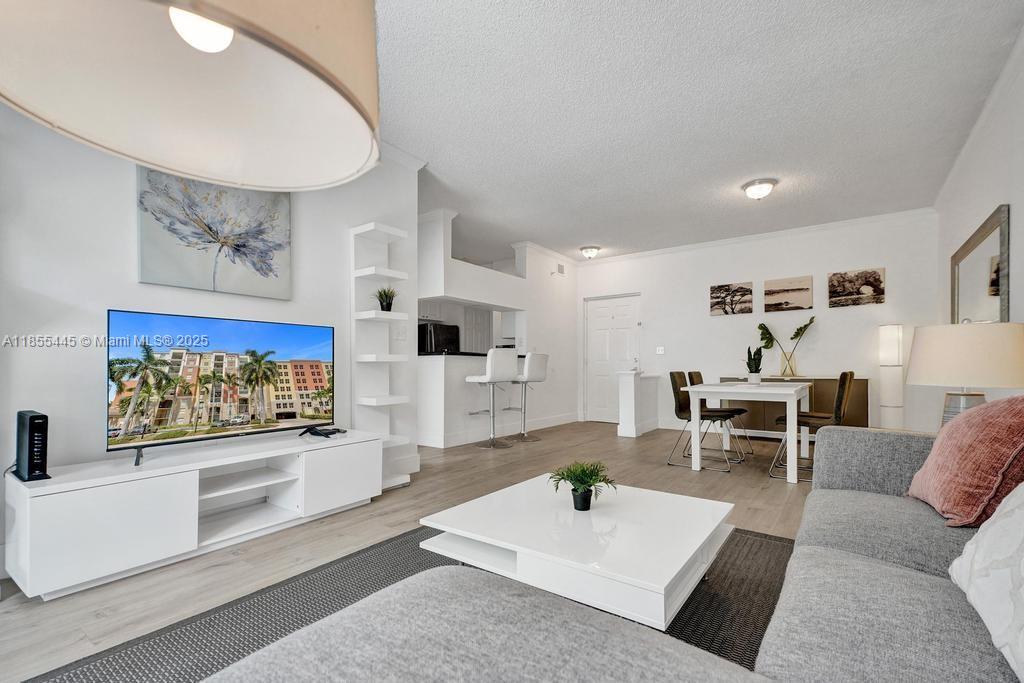 17100 North Bay Road, Unit 1511 Sunny Isles Beach, FL 33160 - Photo 67 of 71 a living room with furniture and view of kitchen