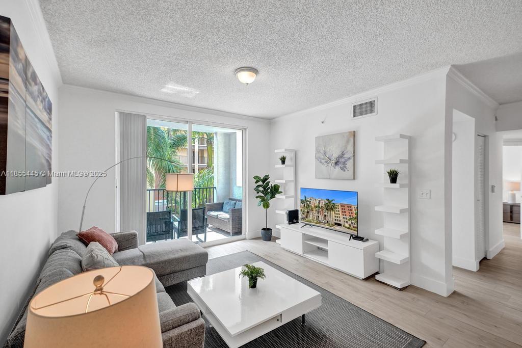 17100 North Bay Road, Unit 1511 Sunny Isles Beach, FL 33160 - Photo 69 of 71 a living room with furniture and a large window