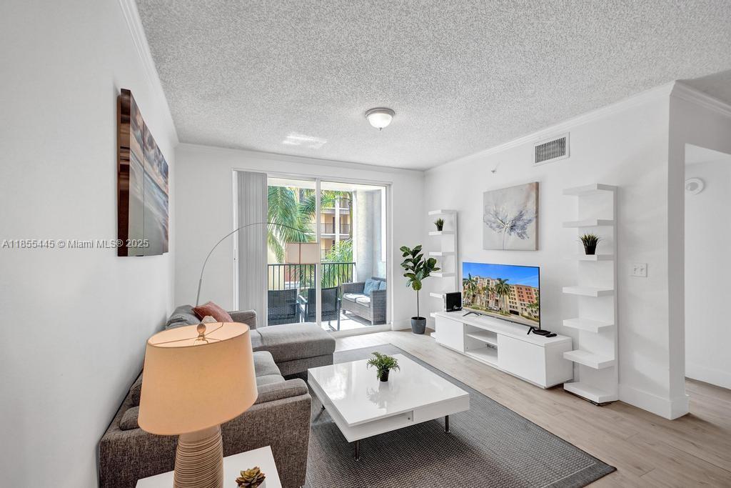17100 North Bay Road, Unit 1511 Sunny Isles Beach, FL 33160 - Photo 70 of 71 a living room with furniture and a window