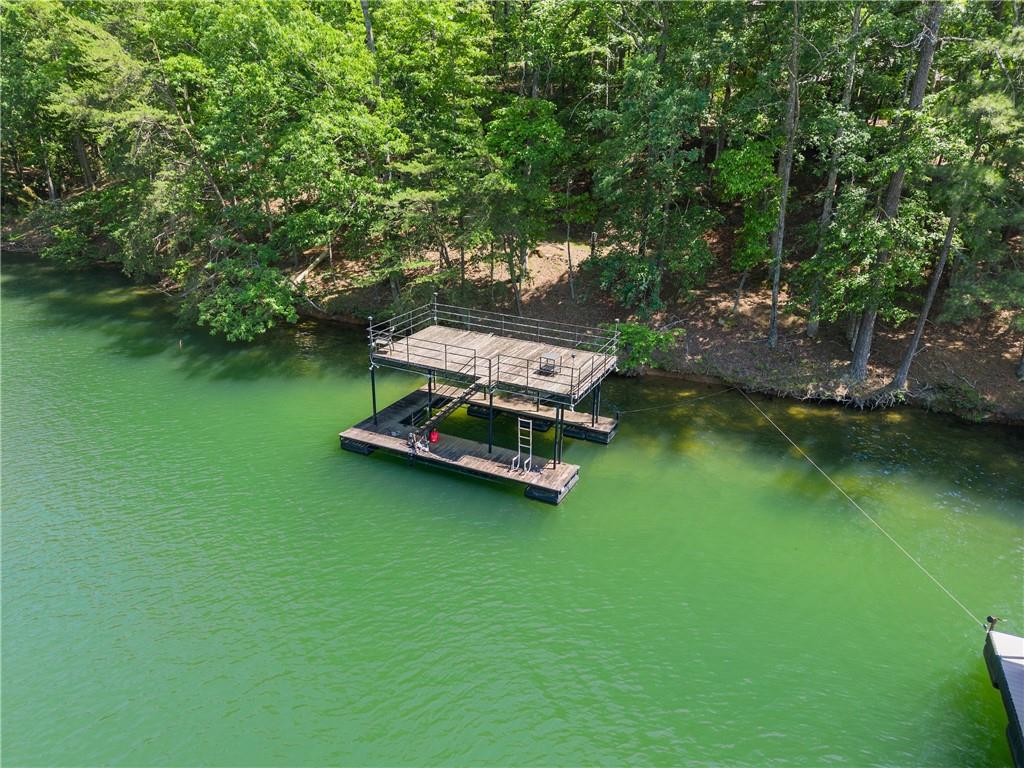 3533 Keith Bridge Road Gainesville, GA 30504 - Photo 1 of 22 a small garden with a bench