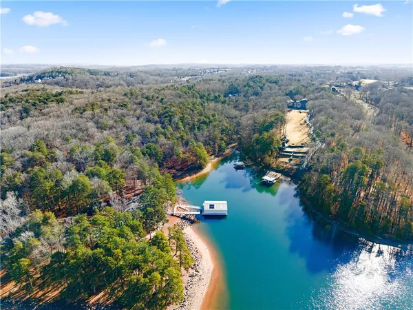 an aerial view of lake residential house with outdoor space and seating