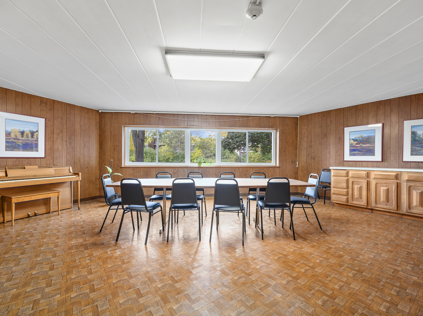 5540 Walnut Avenue, Unit 33A Downers Grove, IL 60515 - Photo 17 of 25 a dining room with furniture a flat screen tv and a window