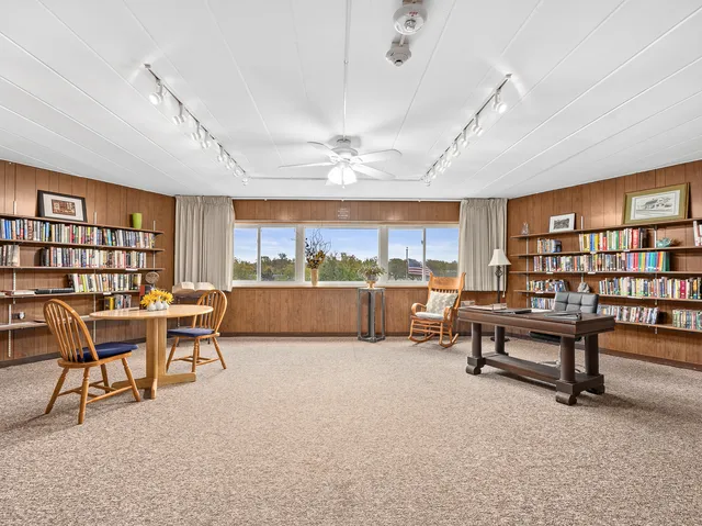 a view of a livingroom with furniture and a table