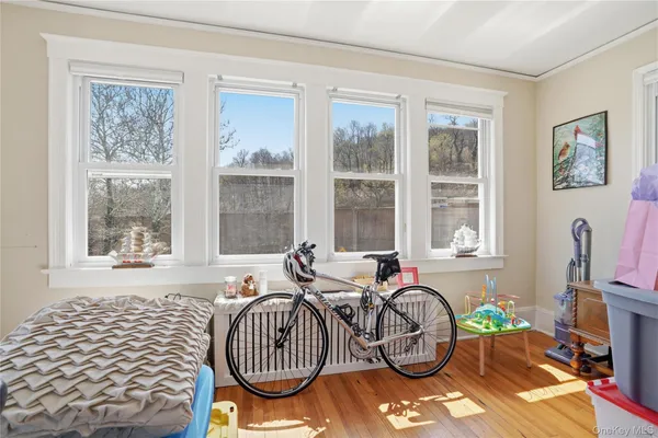 a bedroom with furniture and a window
