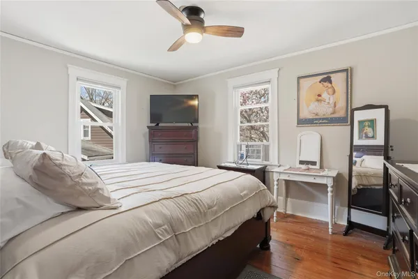 a bedroom with a bed and a desk