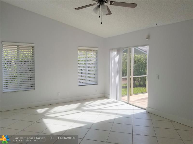 1527 Palermo Drive Weston, FL 33327 - Photo 4 of 16 Family room and screened patio