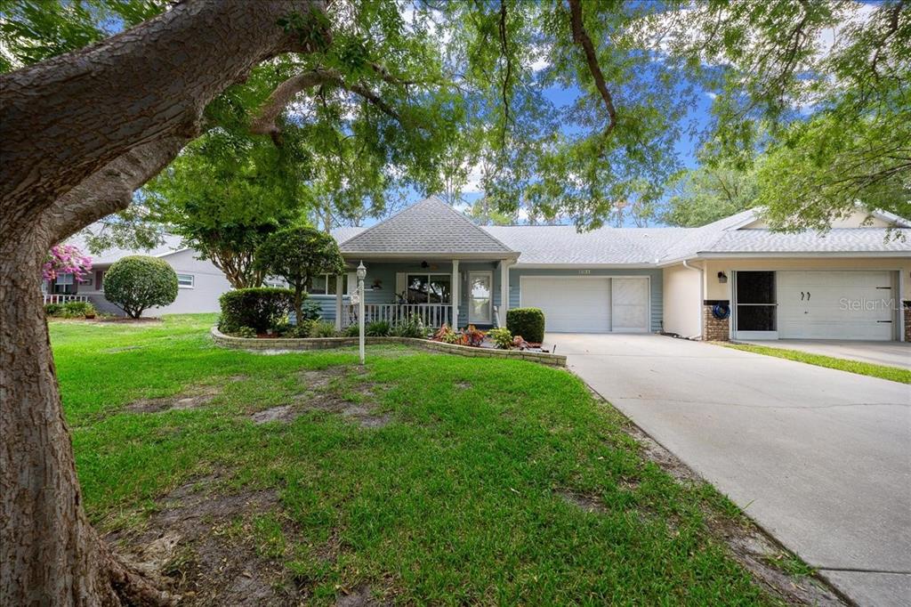 8720 Southwest 90th Street, Unit A Ocala, FL 34481 - Photo 7 of 71 a front view of a house with yard and green space