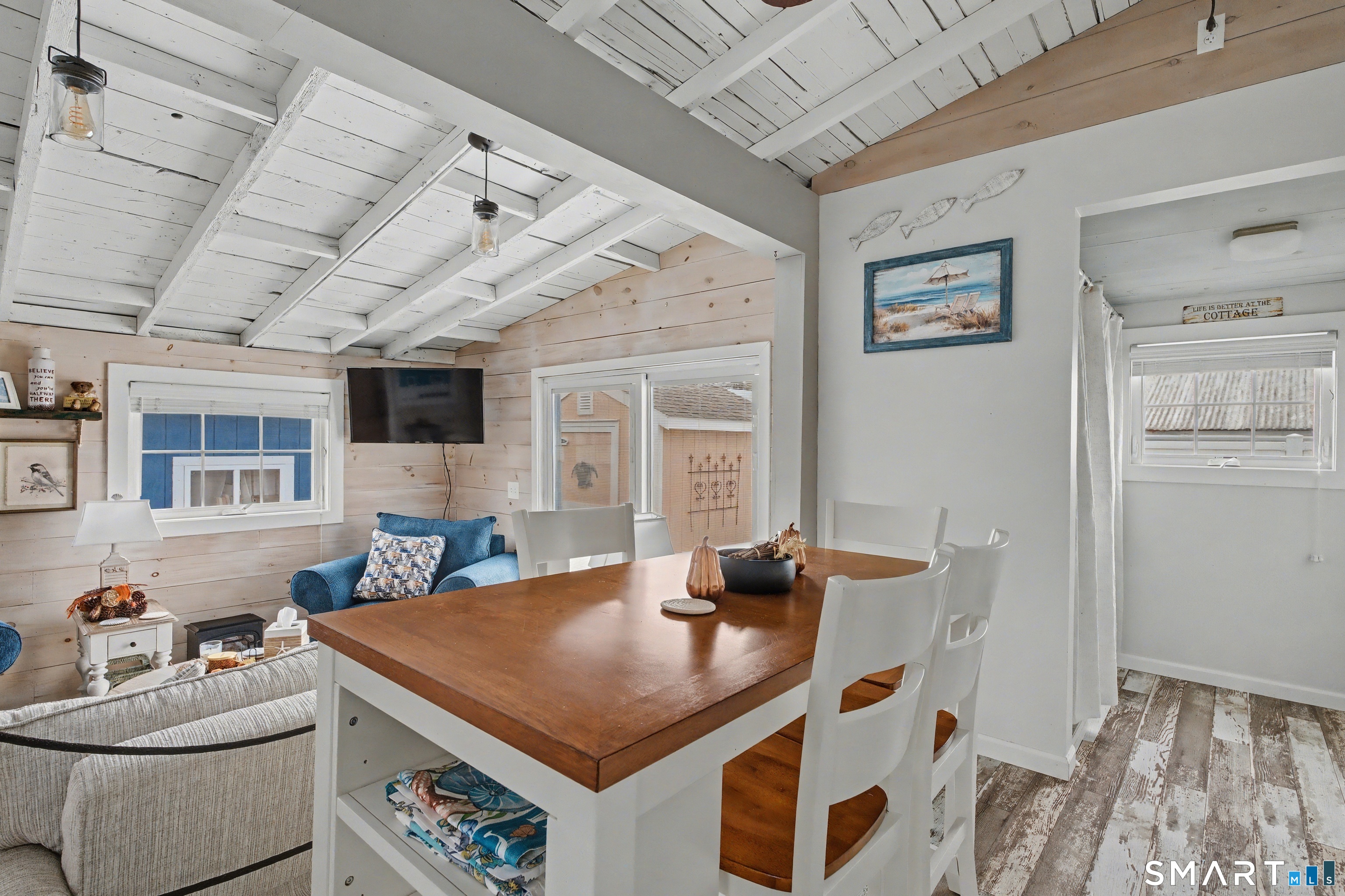 26 North Street Madison, CT 06443 - Photo 11 of 33 a room with furniture and flat screen tv