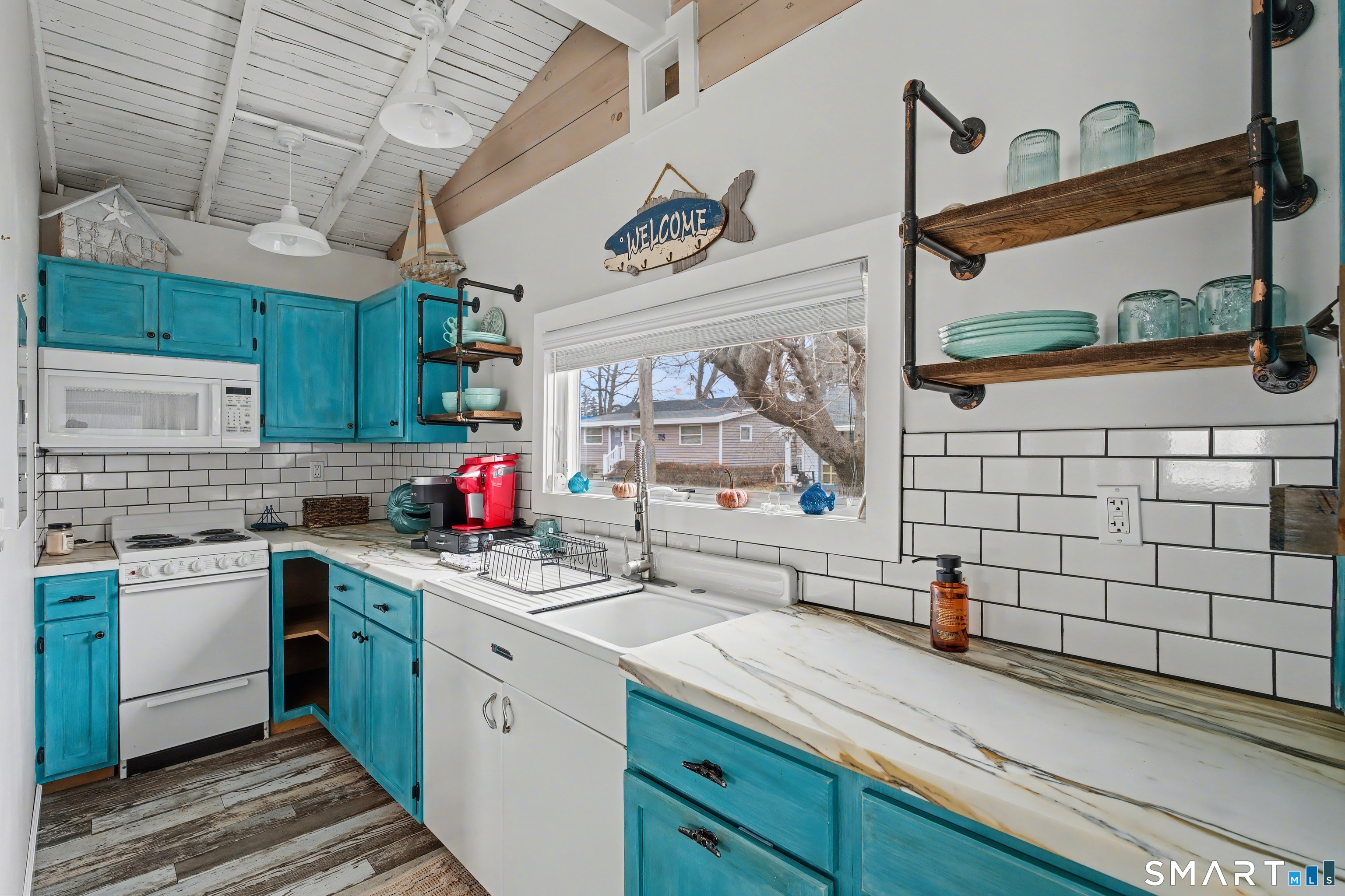 26 North Street Madison, CT 06443 - Photo 14 of 33 a kitchen with a sink cabinets and window