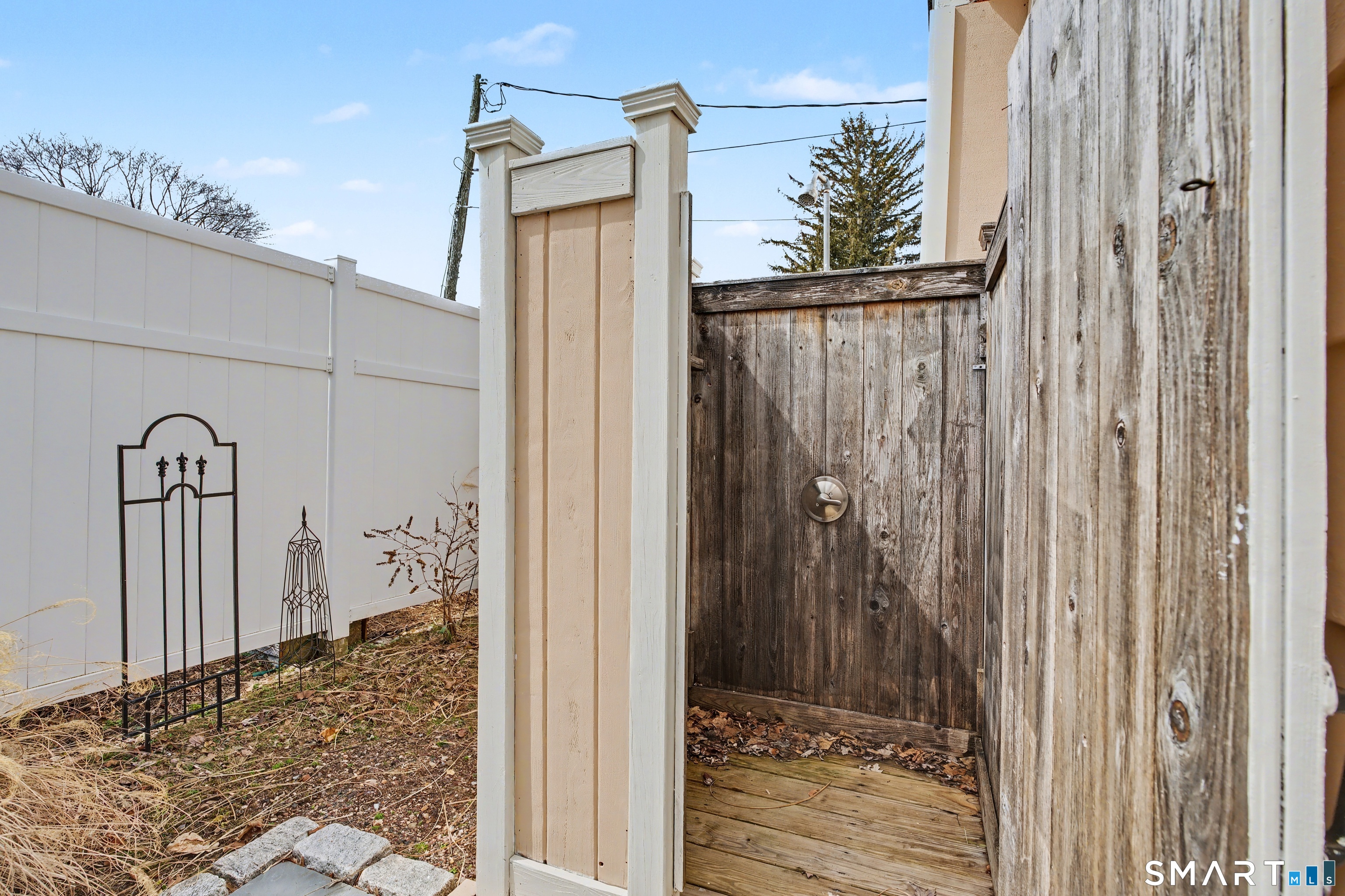 26 North Street Madison, CT 06443 - Photo 26 of 33 a view of a house with a backyard space