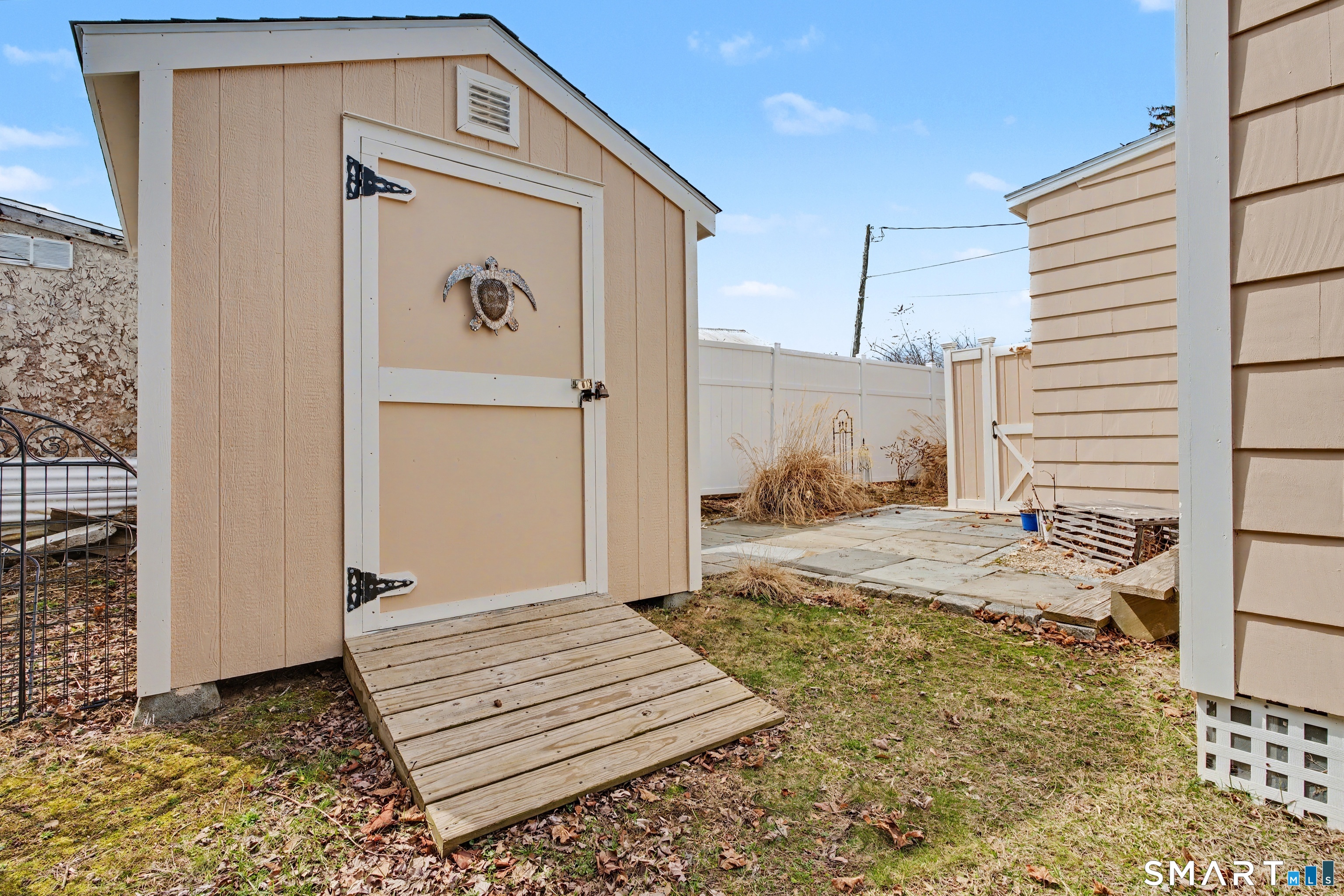 26 North Street Madison, CT 06443 - Photo 31 of 33 a bedroom with a bed and a window