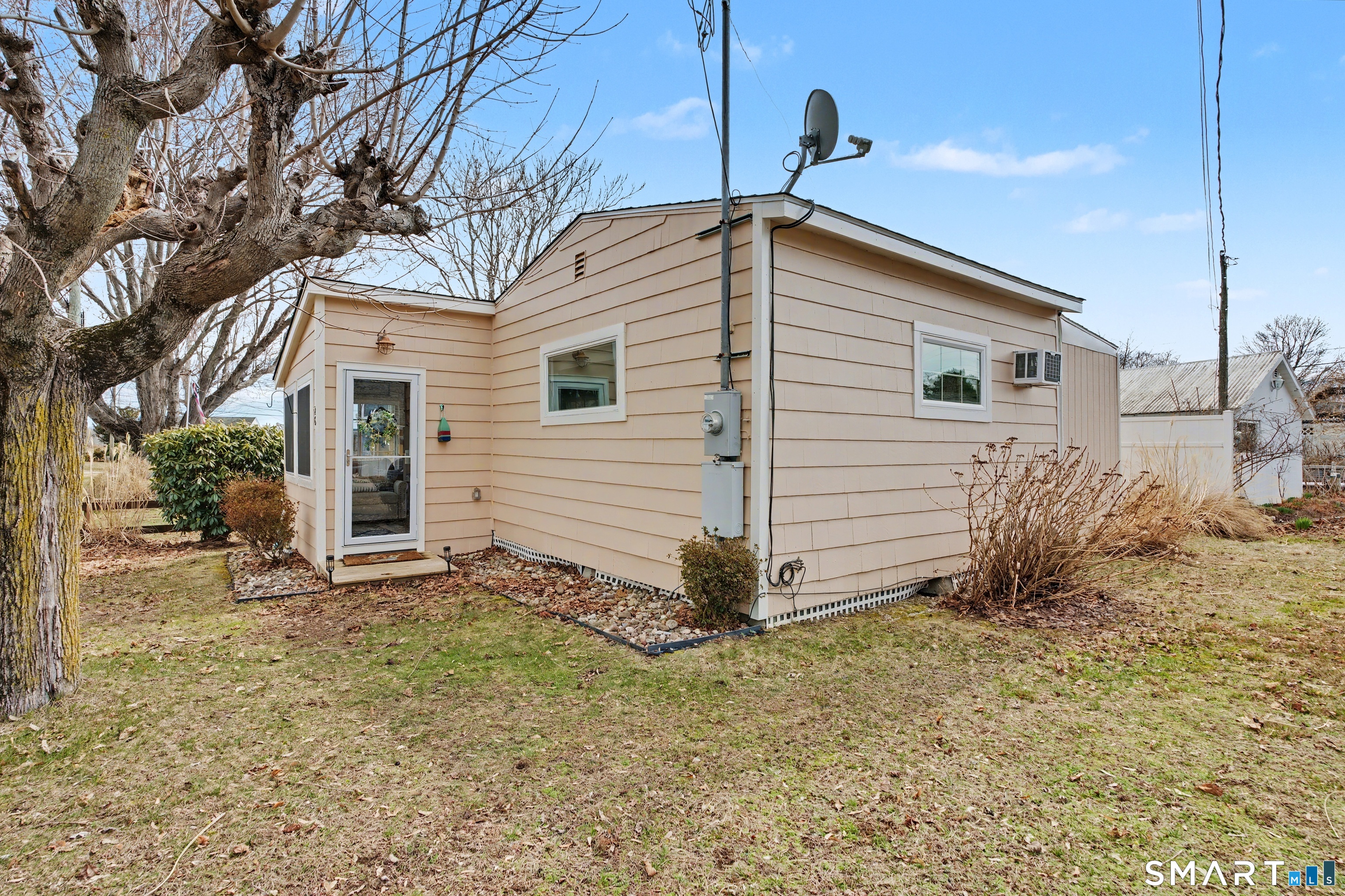 26 North Street Madison, CT 06443 - Photo 32 of 33 a view of a house with a yard