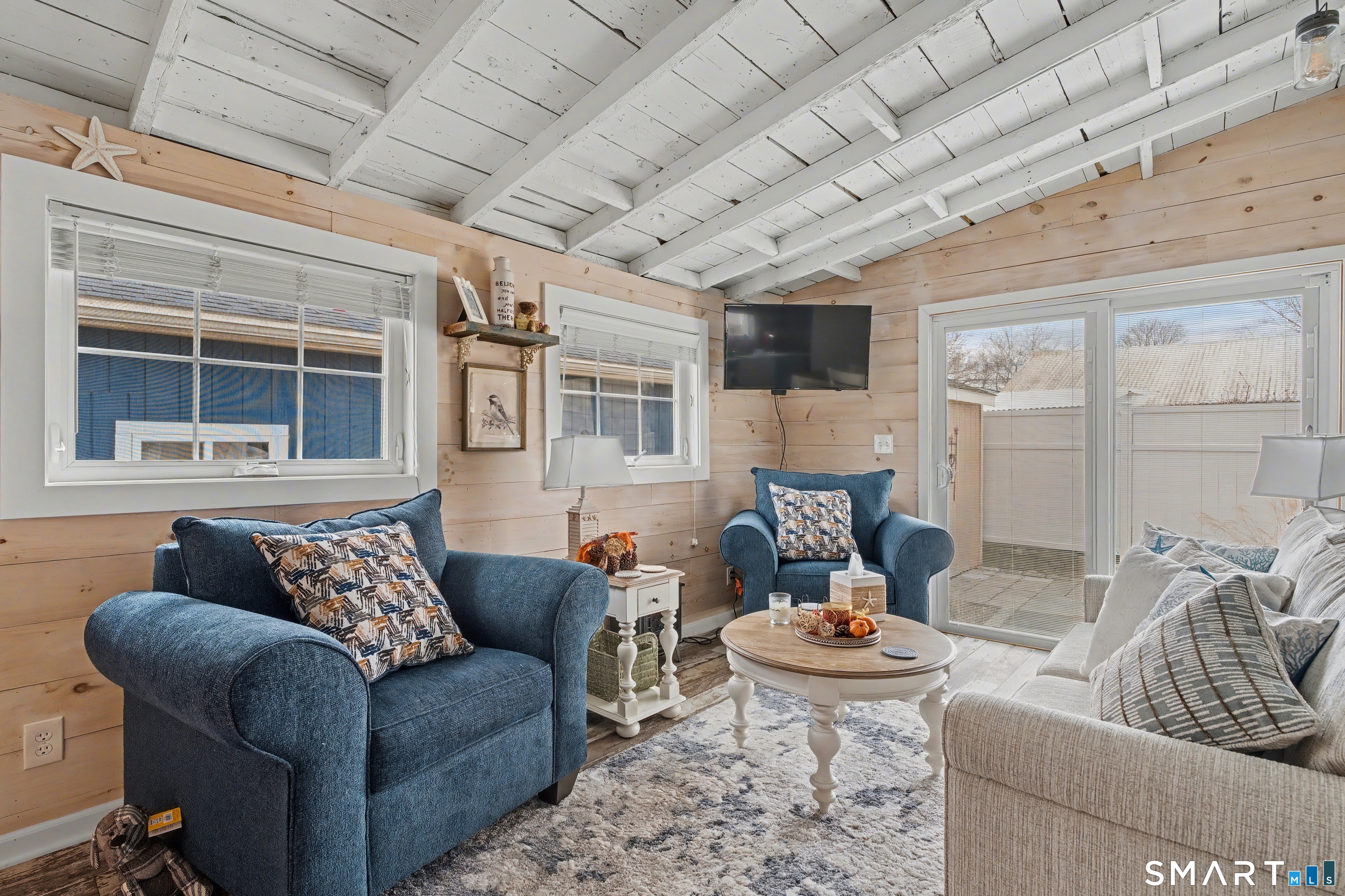 26 North Street Madison, CT 06443 - Photo 4 of 33 a living room with furniture and a large window