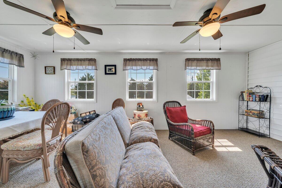3226 Rakes Road Rocky Mount, VA 24151 - Photo 17 of 74 a living room with furniture a flat screen tv and a window