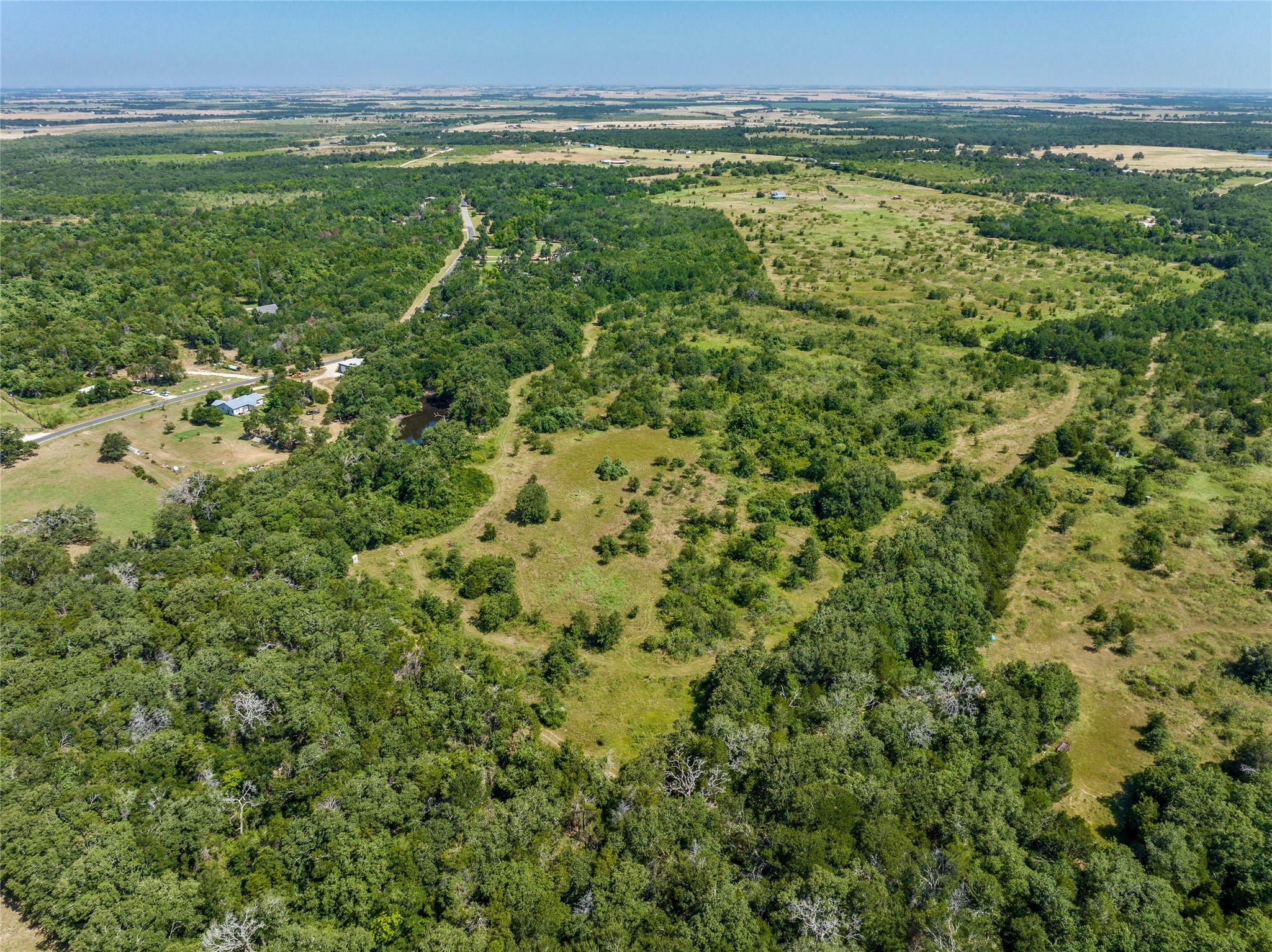 681 County Road 474 Elgin, TX 78621 - Photo 36 of 37 a view of a field with an ocean